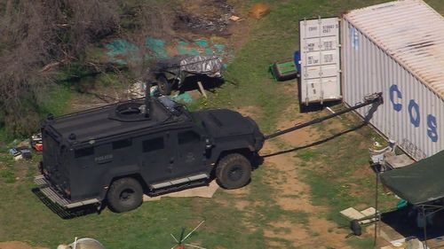 A police "bearcat" with a tool that punched through the shell of a shipping container Freeman was inside.