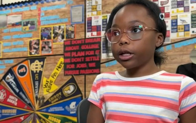 FOURTH GRADER BALANCES ELEMENTARY SCHOOL AND COLLEGE CLASSES