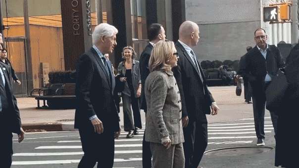 Hillary Clinton caught on video stepping back after pushy former president nudges her at busy NYC intersection