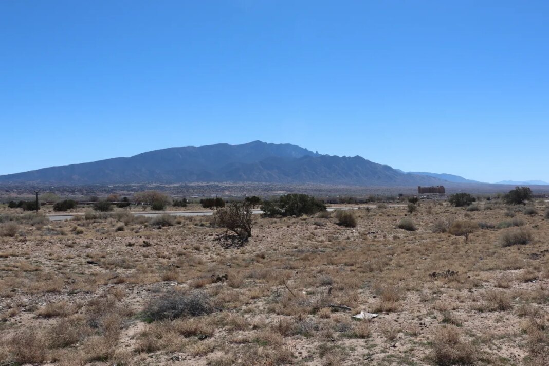 An empty lot between a fire station and a soccer field in the Pueblo of Santa Ana, N.M., near Albuquerque, is seen Friday, March 13, 2026. (AP Photo/Savannah Peters)