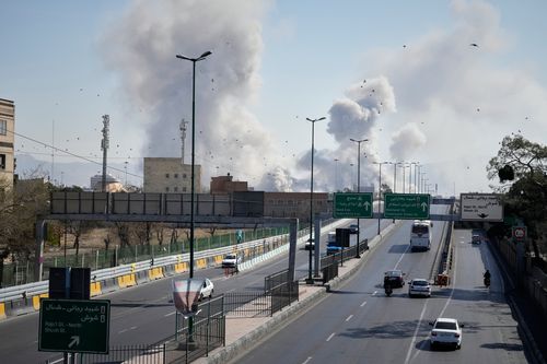 Plumes of smoke rise as strikes hit the city during the U.S.Israeli military campaign in Tehran, Iran, Thursday, March 5, 2026. (AP Photo/Vahid Salemi)