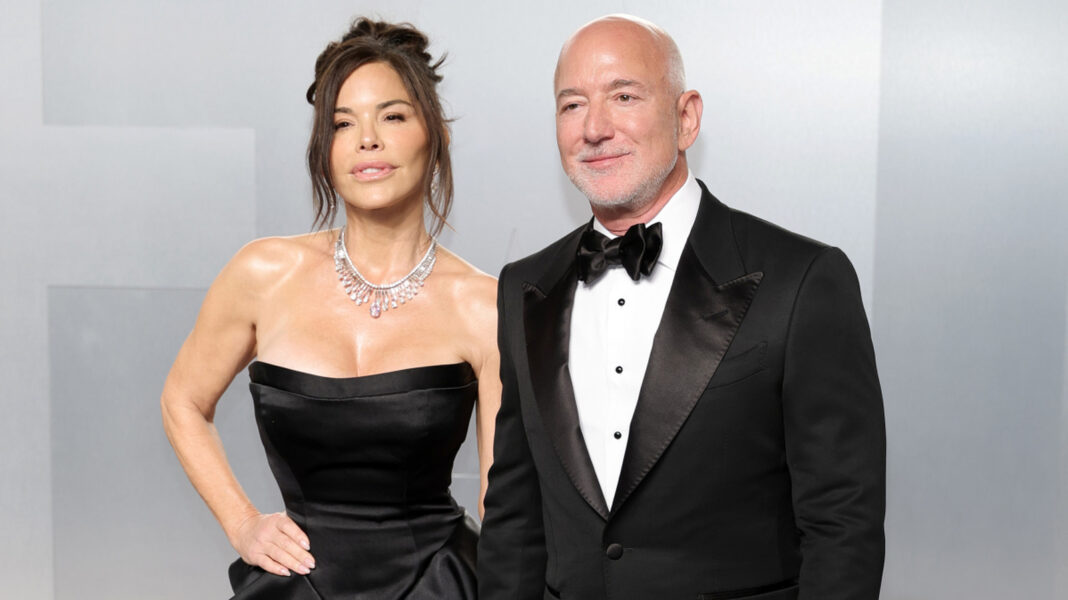 Jeff Bezos Looked So Trained For Wife Lauren Sánchez's Absurd Posing At Oscars 2026