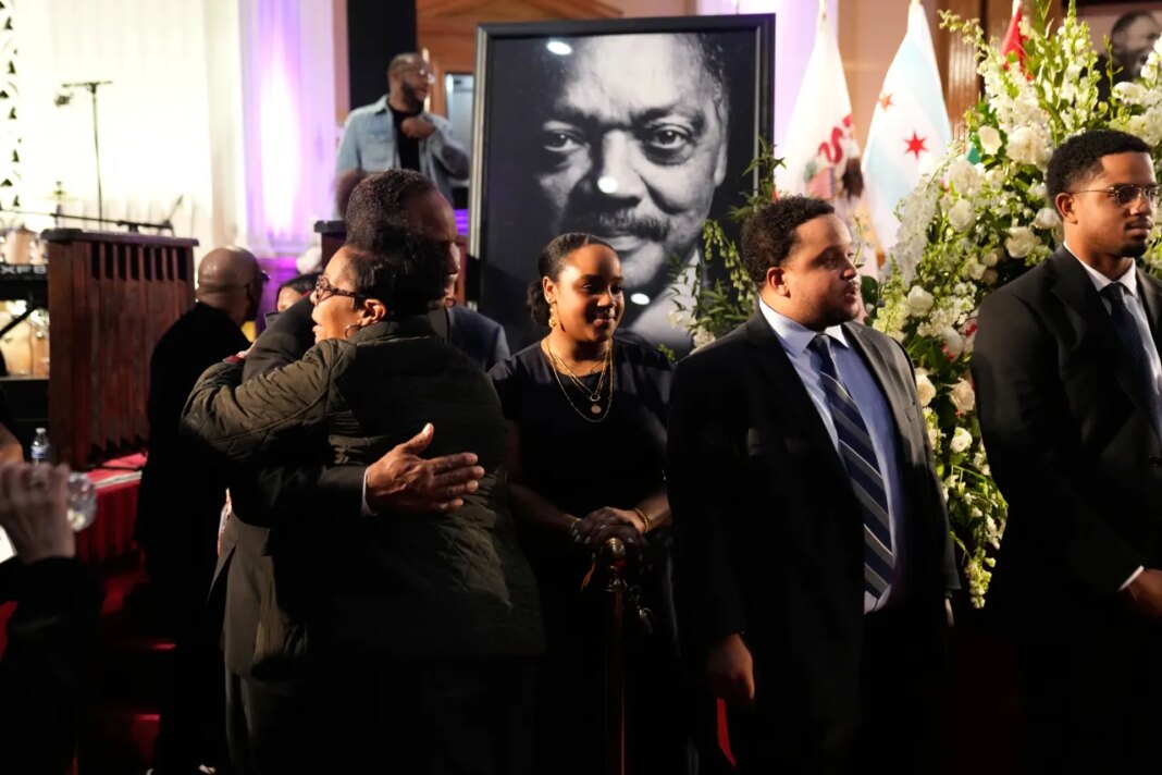 Rep. Jonathan Jackson, D-Ill., hugs a mourner at a public visitation for the Rev. Jesse Jackson at Rainbow PUSH Coalition headquarters Friday, Feb. 27, 2026, in Chicago. (AP Photo/Erin Hooley)