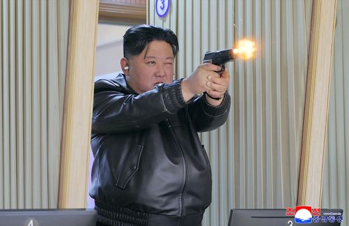 Leather-clad Kim shows off his 'excellent' small gun arsenal