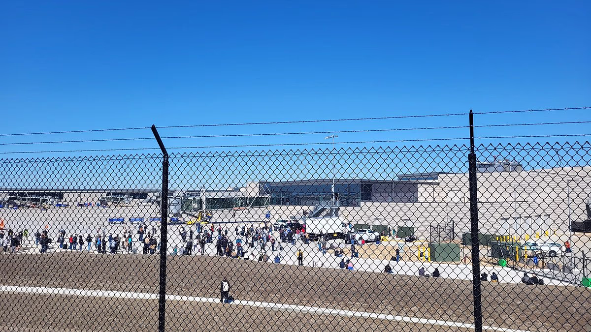 Major Midwest airport is evacuated as passengers flee on to tarmac