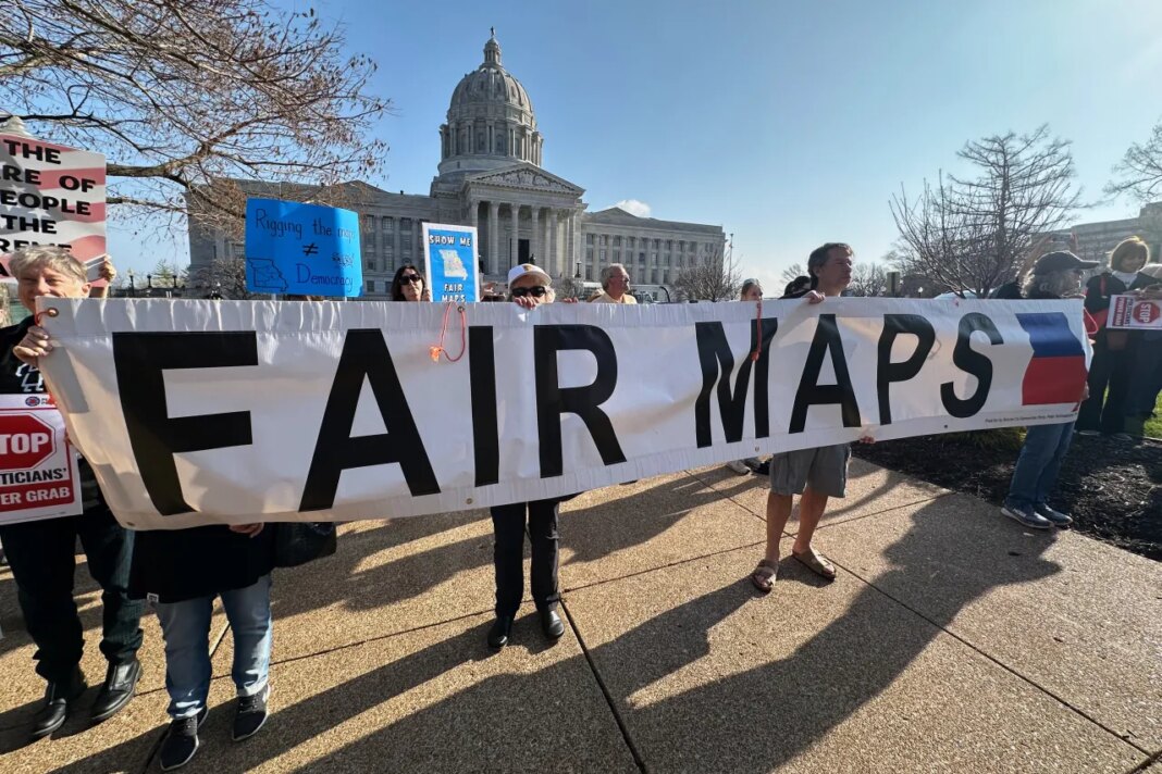 People opposed to new the U.S. House districts passed by the Missouri General Assembly demonstrate outside the state Capitol, in Jefferson City, Mo., Tuesday, March 10, 2026. (AP Photo/David A. Lieb)