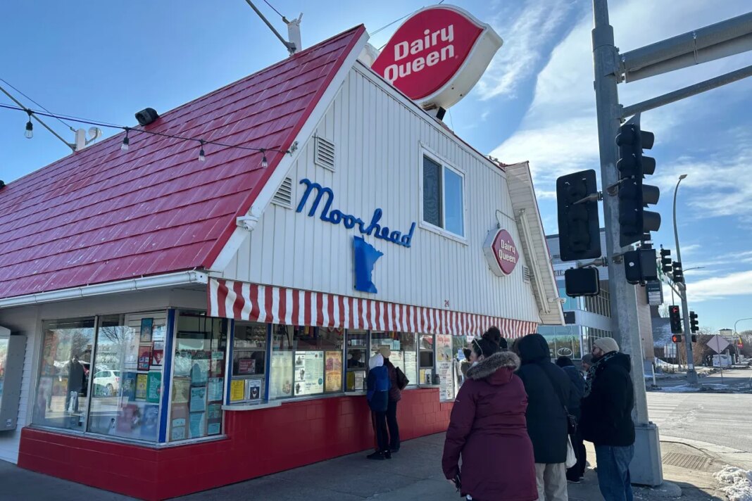 Hold for story - Customers wait their turn to place their order Sunday, March 1, 2026, during the annual opening day of the Dairy Queen in Moorhead, Minn. (AP Photo/Jack Dura)