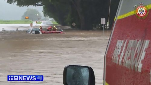 Heavy rainfall in Far North Queensland has sparked rescues for motorists stranded in floodwaters.Rescuers become life savers for the 65-year-old woman stuck on top of her car at Mossman, north-west of Cairns, about 6am today.