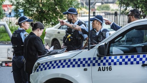 Police at the scene on Shale Street in Lidcombe yesterday.