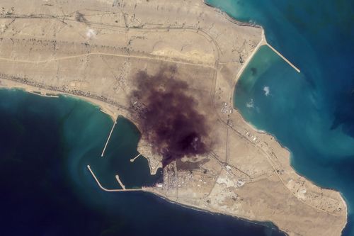 In this satellite photo from Planet Labs PBC, smoke rises over Konarak Naval Basin, Iran, March 1, 2026.  