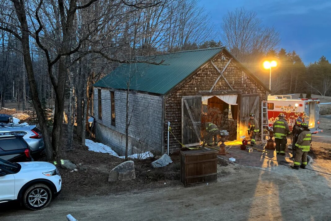 Firefighters work at a building in Tamworth, New Hampshire, where the floor collapsed during a wedding Saturday, March 21, 2026. State Fire Marshal