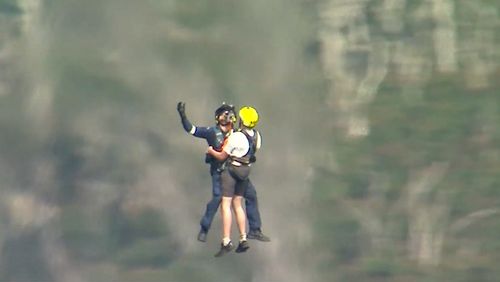 Six teens rescued from Gold Coast mountain one day after fatal cliff fall