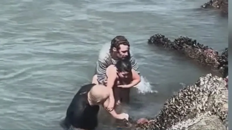 Surf coach rescues father, daughter caught in rip current