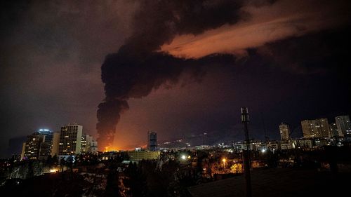Flames and smoke rise from an oil storage facility struck during the US-Israeli military campaign in Tehran, Iran,  
