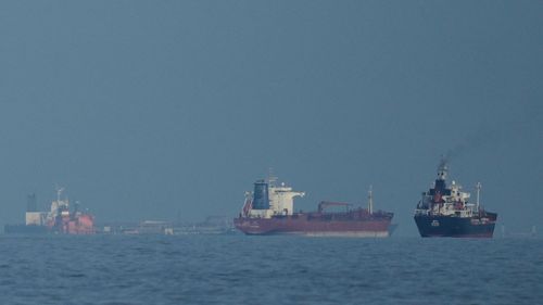 Oil tankers and cargo ships line up in the Strait of Hormuz as seen from Mina Al Fajer, United Arab Emirates, Wednesday, March 11, 2026. (AP Photo/Altaf Qadri)