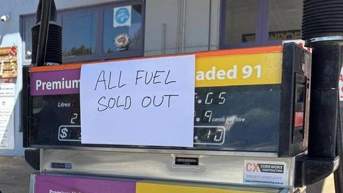 Member for Wagga Wagga Dr Joe McGirr stands by Batlow service station, which has run out of fuel.