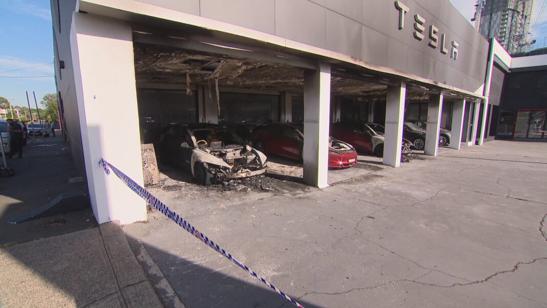 petrol has been used to torch three electric cars in Parramatta in a suspected arson attack