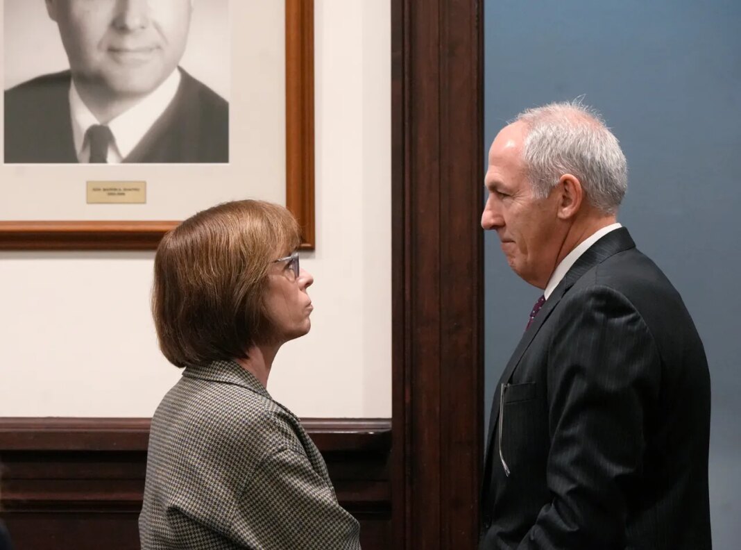 Defense attorney Carole Rendon talks with ex-FirstEnergy Senior Vice President Michael Dowling before the resumption of his trial in Summit County Court of Common Pleas Judge Susan Baker Ross