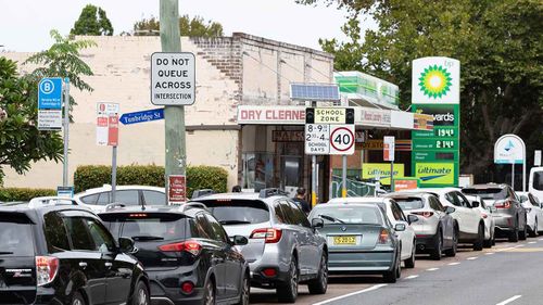 Cars lining up outside a petrol station in Mascot, Sydney.
