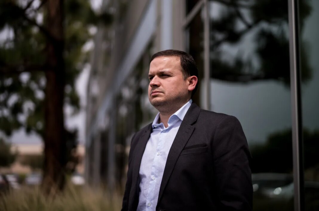 Milenko Faria, whose wife, Dr. Rubeliz Bolivar, is in immigration custody, stands for a portrait after his asylum interview at the U.S. Citizenship and Immigration Services facility in Tustin, Calif., Thursday, April 16, 2026. (AP Photo/Jae C. Hong)