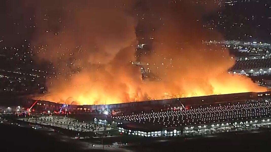 Arson suspect detained after massive fire tears through warehouse in Ontario, California