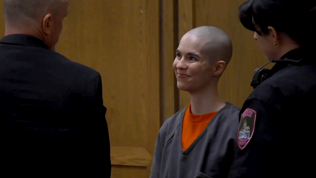 Bald-headed killer smiles as prosecutors reveal what she did before dad walked in