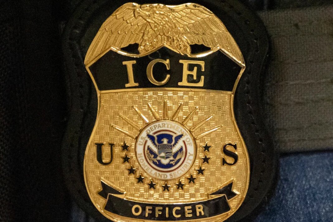 FILE - A federal agent wears an Immigration and Customs Enforcement badge, June 10, 2025, in New York. (AP Photo/Yuki Iwamura, File)