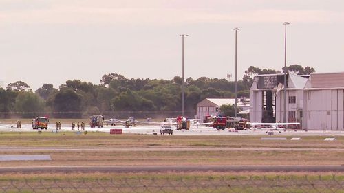 A light plane has crashed into an aircraft hangar in South Australia, just north of Adelaide. Police were called to an area near Kings﻿ Road at Parafield after reports the small aircraft had collided with the hangar as the aircraft attempted to land at the airport.