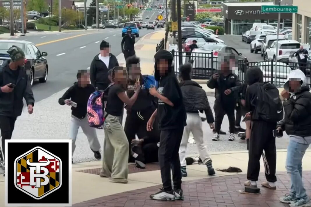 Middle schoolers laugh, smile at camera as brawling peers stomp on victim in wild street fight