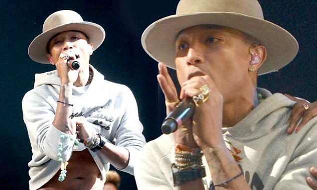 Pharrell WIlliams treats fans to glimpse of his toned stomach at show