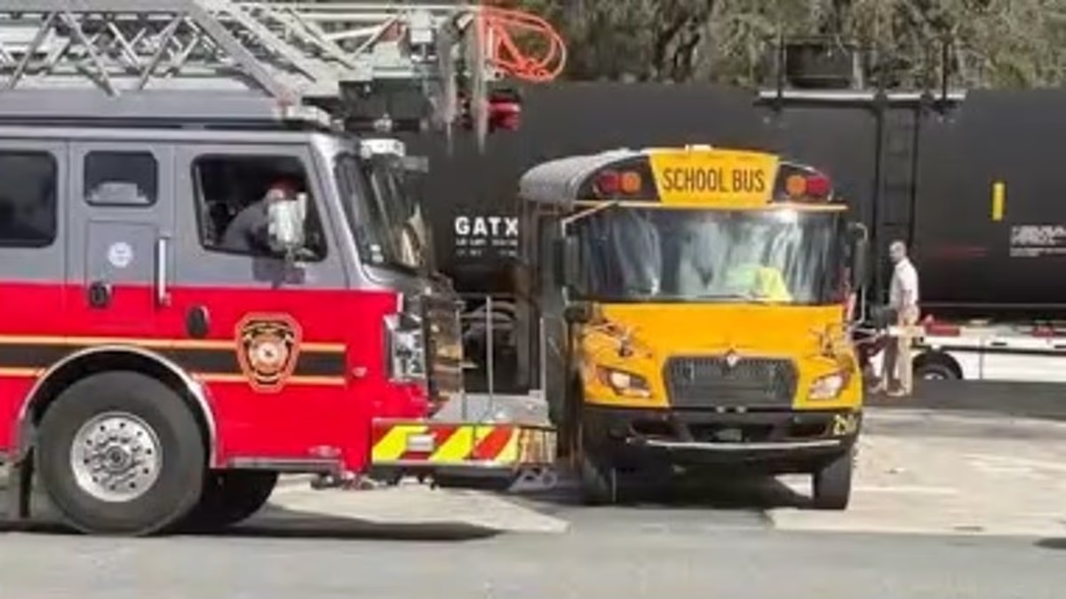 School bus driver steers vehicle packed with kids into path of train