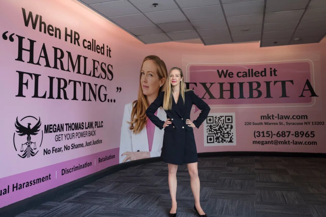 Megan Thomas, a sexual harassment lawyer in Syracuse, poses for a portrait with her advertisement at the Syracuse Hancock International Airport on Wednesday, March 25, 2026, in Syracuse, N.Y. (Chloe Trofatter/The Post-Standard via AP) CORRECTION: Corrects from Regional to International.