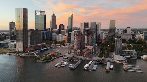 Perth, Australia - March 27, 2025: Drone photograph of buildings around Elizabeth Quay at sunset.
