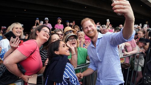 These photos of Harry and Meghan could land Aussies in hot water