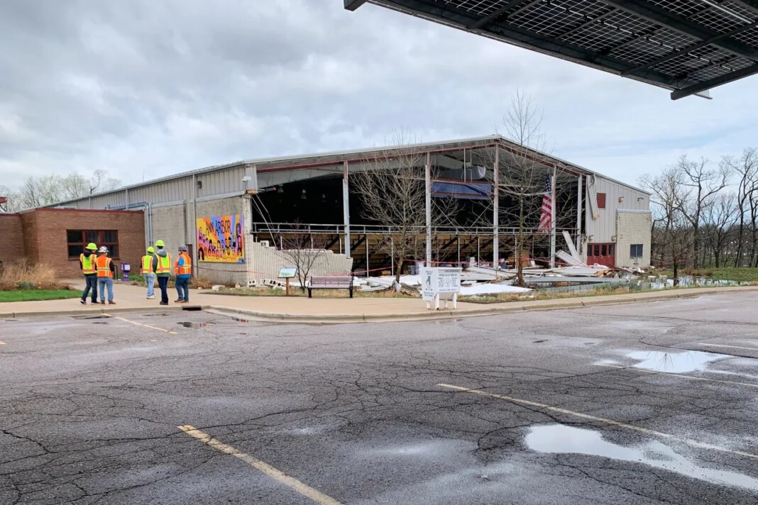 A wall, torn off of the Veterans Memorial Ice Rink following a severe storm, is seen Wednesday, April 15, 2026, in Ann Arbor, Mich. (AP Photo/Mike Householder)