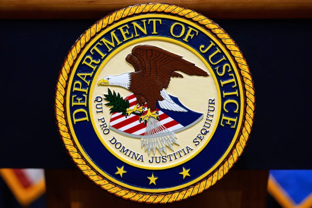 FILE - The U.S. Department of Justice logo is seen on a podium before a news conference at the Justice Department in Washington, on May 6, 2025. (AP Photo/Julia Demaree Nikhinson, File)