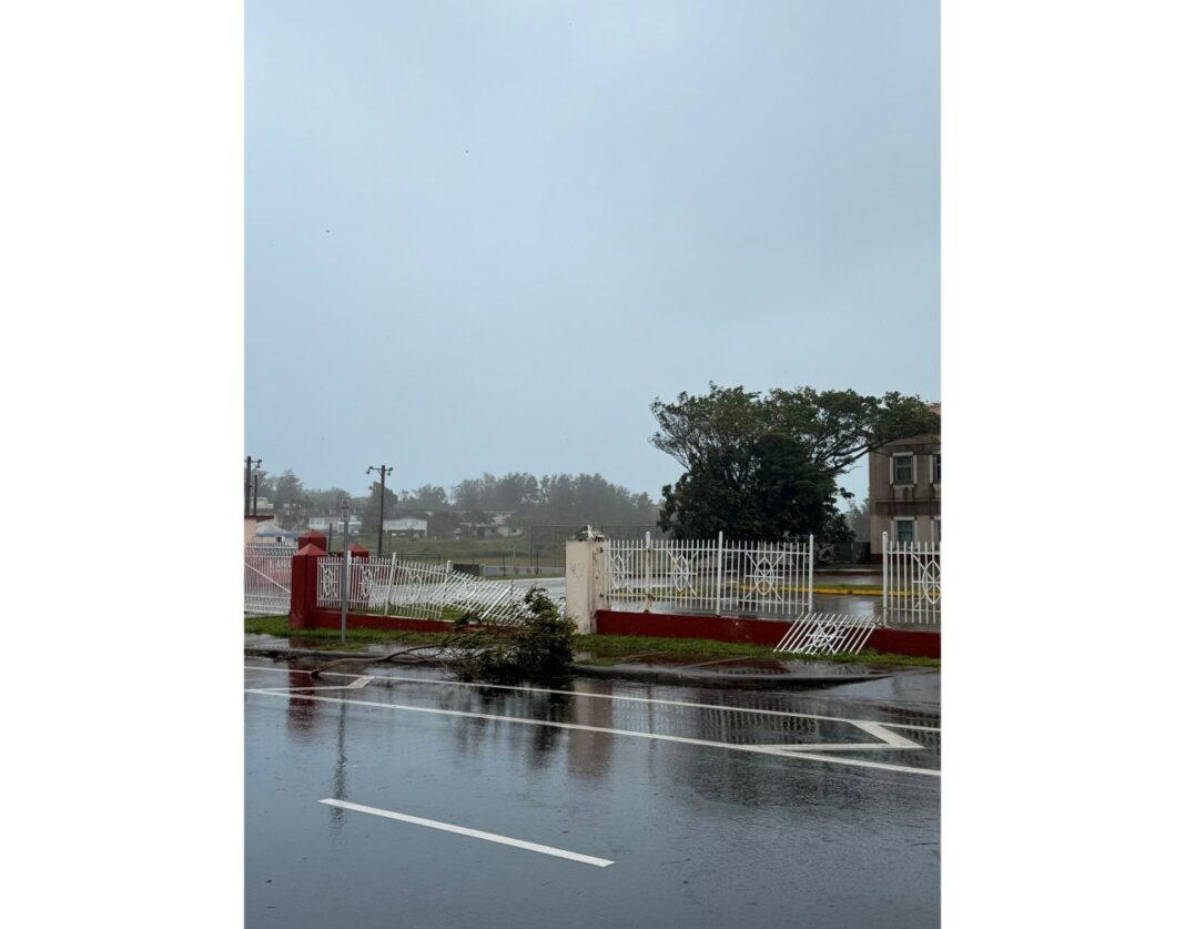 Portions of the gate fronting Tamuning Elementary School, in Tamuning, Guam, have broken off as Super Typhoon Sinlaku