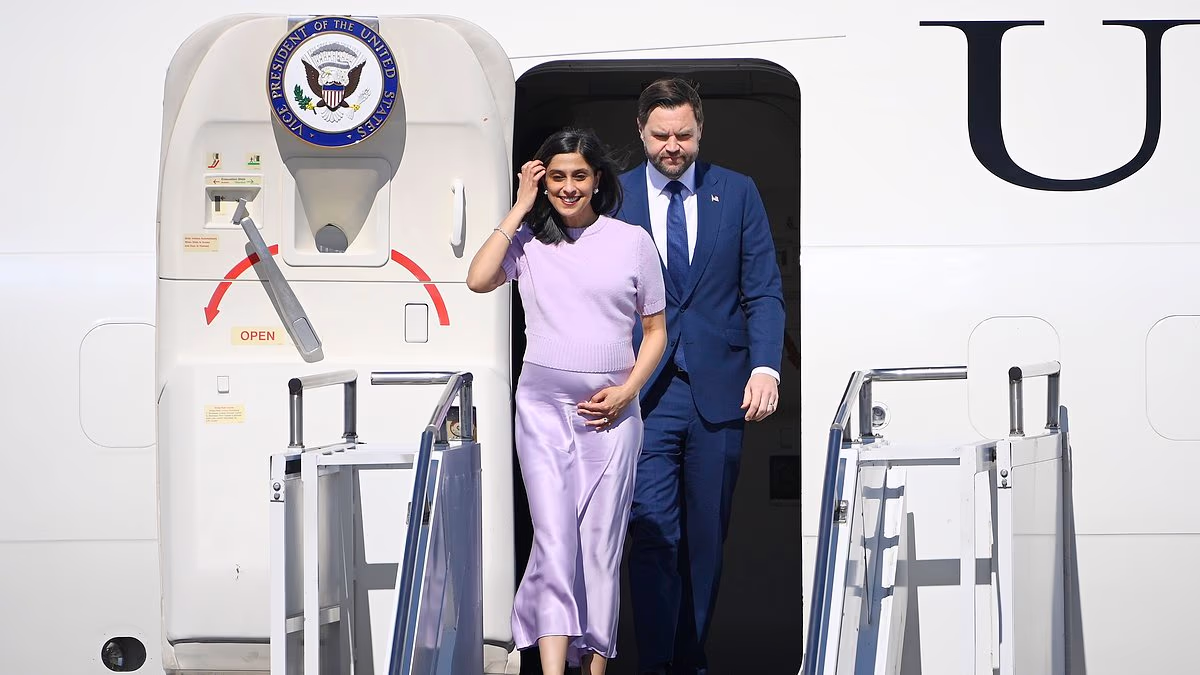Usha Vance cradles her growing baby bump as she joins JD in Hungary