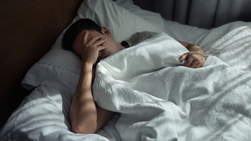 Sad lonely tired man home alone.