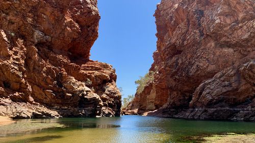 A spectacular waterhole cutting through a gorge in the West MacDonnell Ranges
