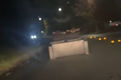 Alarming footage shows 'couch riders' driving down dark Canberra street