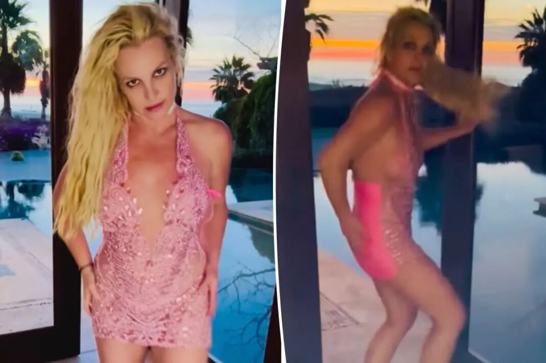 Britney spears slaps her butt while dancing in hot pink mini dress following reported restaurant drama