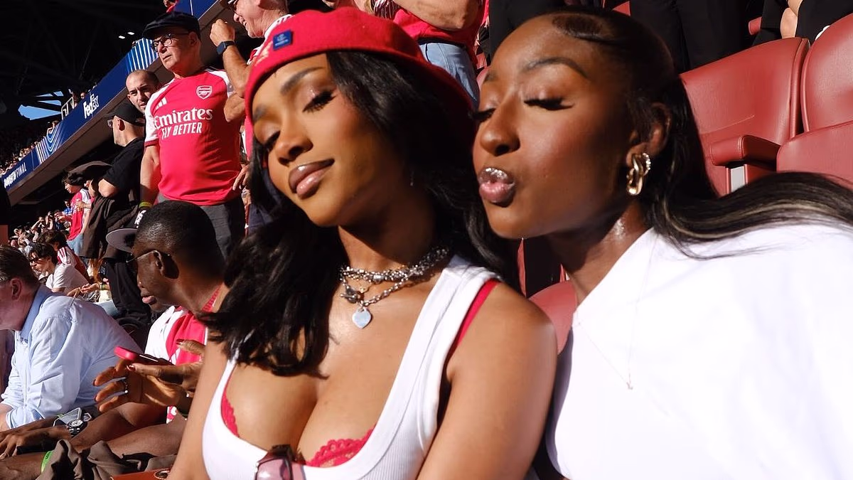 Bukayo Saka's fiancée Tolami Benson stuns in red as she leads the glamorous WAGs cheering on Arsenal from the stands at the Champions League final