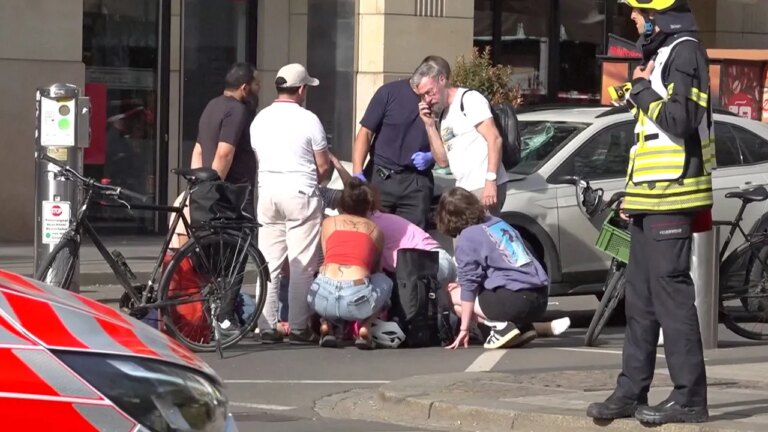 Tragic Incident: Car Crashes into Pedestrian Area, Leaving Two Dead; Driver in Custody as Police Probe Intent