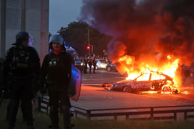 Hundreds arrested as shops and cars burned in wild football celebrations