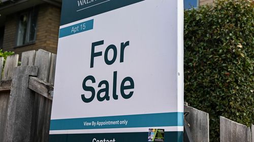 A for sale sign on a home.