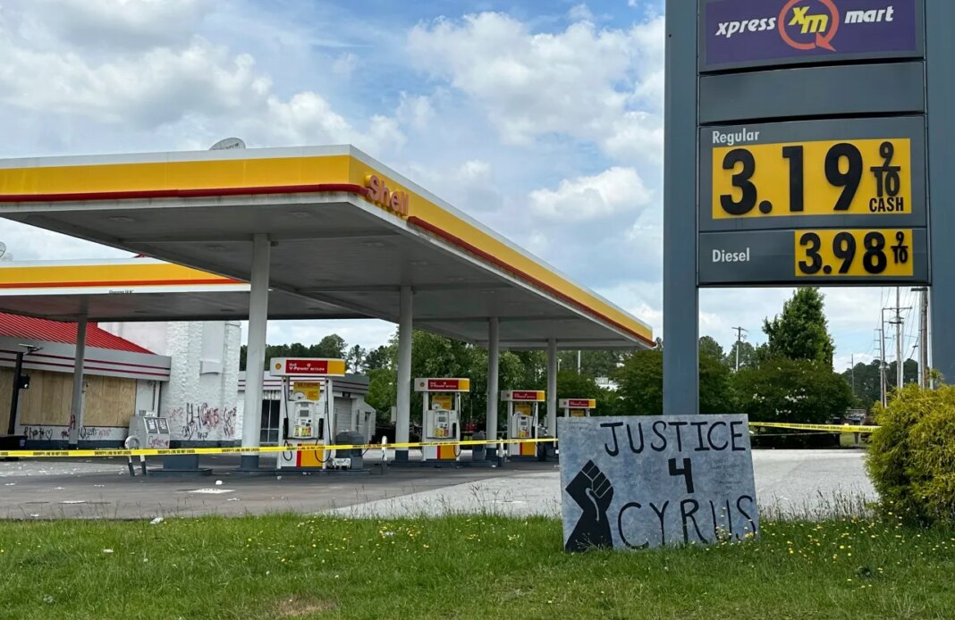 FILE - A sign calling for justice is for Cyrus Carmack-Belton is seen outside a gas station June 1, 2023, in Columbia, S.C. (AP Photo/Jeffrey Collins, File)