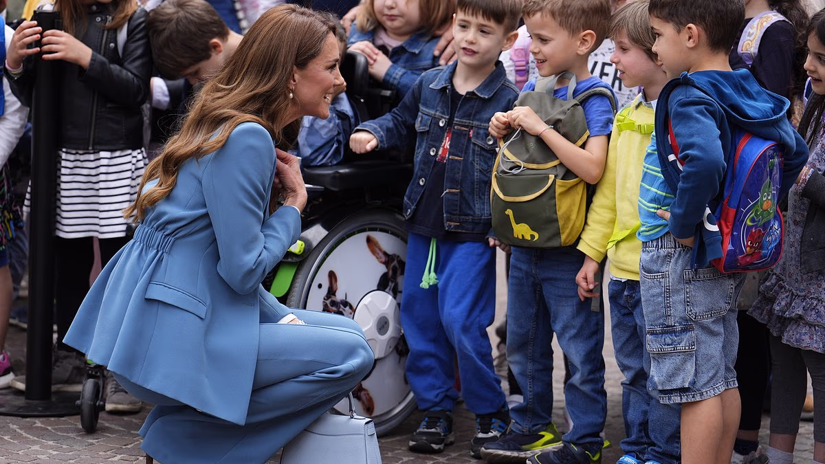 Kate surprises fans by placing her pristine handbag on the ground while chatting to children in Italy