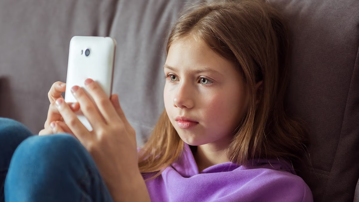 Kids aged 10 more likely to own a phone than know how to throw a ball amid rise of 'iPad kids'