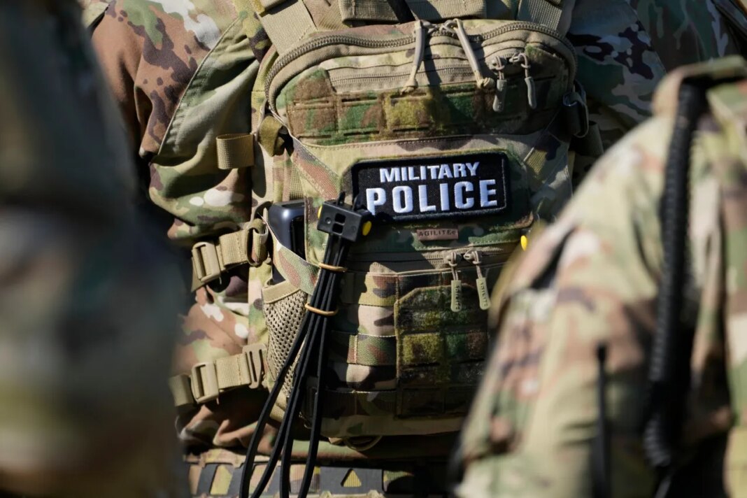 FILE - Members from the National Guard working as part of the Memphis Safe Task Force conduct a community safety patrol at Tom Lee Park, Oct. 12, 2025, in Memphis, Tenn. (AP Photo/George Walker IV, File)